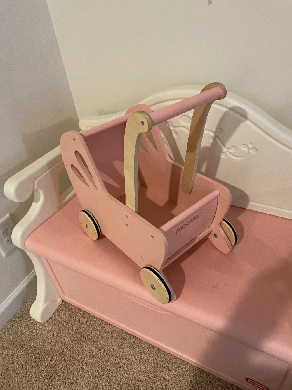 Pink wooden doll stroller